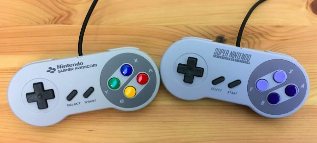 A Japanese Super Famicom controller and a North American Super NES controller side-by-side.There are L and R Buttons are on the "shoulders" of each controller. A Japanese Super Famicom controller and a North American Super NES controller side-by-side.There are L and R Buttons are on the "shoulders" of each controller.